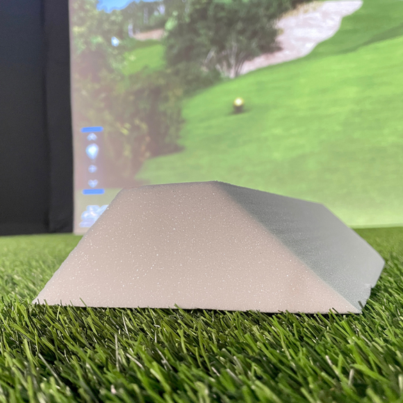 Carl's Place Foam Inserts for DIY Golf Simulator Enclosure displayed on a piece of turf.