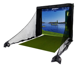 A golf simulator setup with a screen displaying a golf course image, surrounded by protective nets, and a green hitting mat in front.