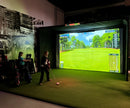 Kid using golf simulator and swinging in Parlour 16H golf enclosure