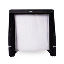 A black and white sports net is set up, designed for indoor use. It has a white mesh backdrop and is surrounded by a black frame.