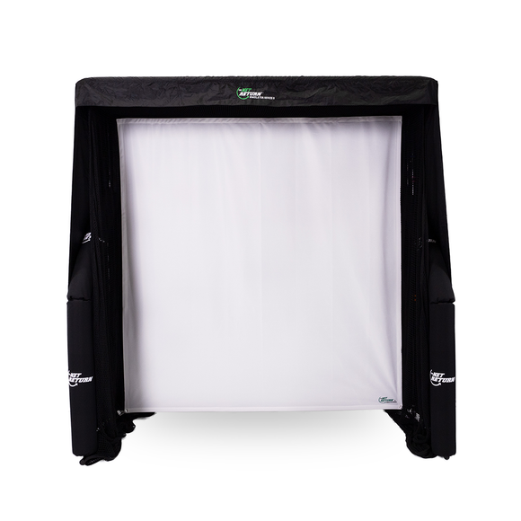 A black and white sports net is set up, designed for indoor use. It has a white mesh backdrop and is surrounded by a black frame.