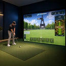 A golfer using a TruSim impact screen in their golf simulator setup