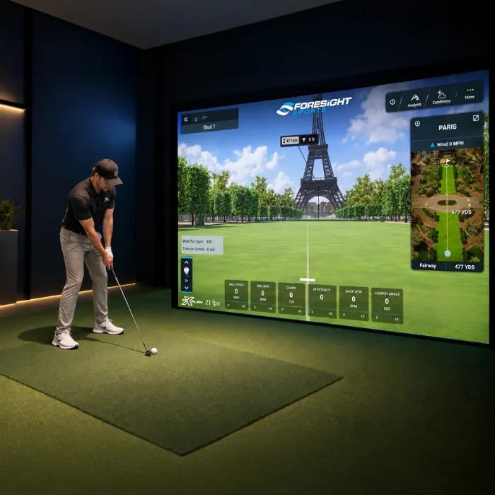A golfer using a TruSim impact screen in their golf simulator setup