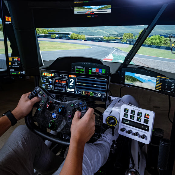 Hands on the Fanatec Podium steering wheel in the Turnkey Racing Sims Formula Motion