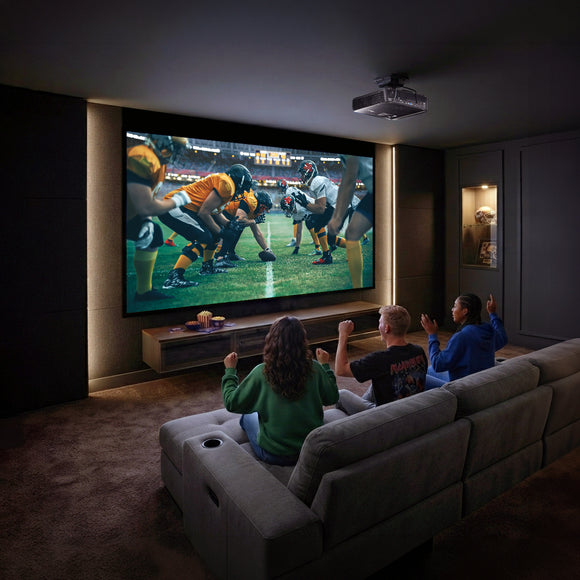 Optoma GT2300HDR projector in a home theater showing a football game