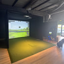Rain or Shine Golf Studio Turf Sim Flooring Kit in a golf simulator bay, angled view with the inset SwingTurf hitting area