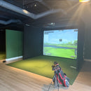 Rain or Shine Golf Studio Turf Sim Flooring Kit covering a golf simulator bay floor with a golf bag in front