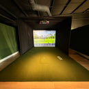 Rain or Shine Golf Studio Turf Sim Flooring Kit inside a golf simulator enclosure, straight on view showing the SwingTurf hitting area set flush into the turf