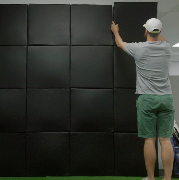 ROS Signature Golf Simulator Wall Padding installed around an impact screen in a golf simulator room