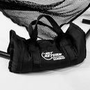 A black duffel bag labeled "The Net Return Heavyweight Sandbag" placed on a white surface with netting and metal poles in the background.