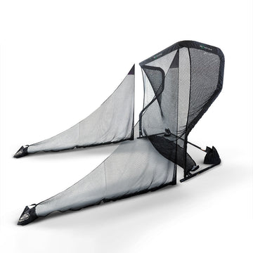 A large black mesh golf ball collector, designed to capture and store golf balls during practice.