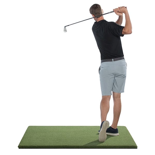 guy swinging on 4x5 swingturf mat