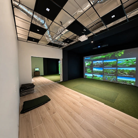 A TruSim impact screen in a golf simulator setup